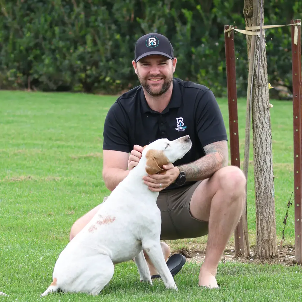 Dan White, founder of Buyers First Agency, with his dog